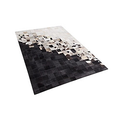 Beliani Tapis en cuir noir et blanc 140 x 200 cm KEMAH