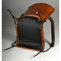 Aubry Gaspard Fauteuil en cuir de buffle, métal et bois verni.