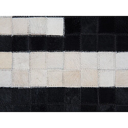 Acheter Beliani Tapis noir et crème en peau de vache 80 x 150 cm BOLU