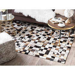 Avis Beliani Tapis en cuir blanc et beige 140 x 200 cm CERLI