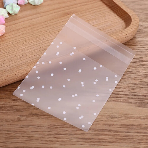 Wewoo 100 PCS Sacs de cellophane en plastique transparents Polka Dot Candy Sac cadeau avec poche auto-adhésive DIY Celofan pour la fêteTaille 8x10cm Transparent